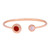 An image of a Bvlgari Classic women's open flip bracelet, displayed against a white background. The bracelet is in a rose gold tone with a sleek, open bangle design. It features two circular gemstone settings-Carnelian and mother of pearl at each end . Both settings have the brand's name engraved around the perimeter. The bracelet is positioned horizontally in the center of the frame, with a slight angle to show the three-dimensional aspect of the gemstone settings. The shot is taken from a top-down perspective at a close distance to capture the details of the gemstones and engravings. The condition of the bracelet is new. 