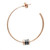 An image of a Bvlgari B.Zero1 ceramic hoop women's earring without stones, presented in a close-up front view. The earring is designed as a single, large rose gold hoop with a smooth, polished surface, interrupted by a distinctive section near the bottom featuring Bvlgari's signature black ceramic rings flanked by two smaller rose gold rings with engraved branding. The earring post and backing are clearly visible at the top, indicating how it is worn. The angle of the photograph provides a clear and detailed view of the earring's design and craftsmanship.The condition of the earrings are new. 