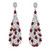 An image of a pair of Rachel Koen women's earrings featuring sparkling diamonds and rich red ruby gemstones. The earrings are displayed in a front-facing view at a close distance, showing the intricate design of teardrop-shaped gemstones nested within halos of round brilliant-cut diamonds, creating an elegant cascading effect. The earrings hang vertically, showcasing their full length and the symmetrical arrangement of stones in white gold metal.