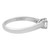 An image of a Tiffany & Co. women's engagement ring with diamonds, displayed at a three-quarter angle showcasing the ring's profile. The ring features a single diamond in a four-prong setting, with the platinum band's curvature visible. The distance is close enough to reveal the ring's interior engraving and the metal's polished finish.