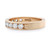 An image of a Rachel Koen women's ring with diamonds, displayed in close-up at a slight angle to show both the top and side views. The ring is crafted in yellow gold featuring a row of large round-cut diamonds set across the top half of the band, with the brand's hallmark visible on the inner side. The diamonds are positioned in a line with their facets catching the light, while the smooth polished gold band completes the elegant design.The ring is pre-owned in a great condition.