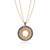 An image of a new Luca Carati women's pendant necklace with diamonds, featuring a circular pendant with concentric circles of brown and white round cut diamonds set in yellow gold with chain. The pendant is centered and viewed frontally at a close distance, showcasing the intricate design and sparkling stones against a white background with a subtle reflection below.