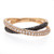 An image of a Piero Milano women's ring with white and black diamonds, showcasing a close-up view on a white background. The ring features a rose gold band with two intertwined bands, one adorned with pave set white diamonds and the other with black diamonds. The details of the diamonds are visible, sparkling against the polished rose gold. The brand name "Piero Milano" is engraved on the inner side of the band, indicating its authenticity. The earring is positioned at a slight angle to show the interplay of light and the intricate design.