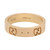 An image of a Gucci women's ring without stones, presented in a centered, close-up view showcasing the band's exterior. The ring is positioned horizontally, angled slightly to the right to reveal the iconic Gucci 'GG' logo and hallmark engravings inside the band. The gold-toned ring features a smooth finish with evenly spaced, small circular indents around the circumference.The ring is pre owned in a great condition. 
