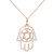 An image of a Rachel Koen brand Hamsa necklace designed for women, featuring a rose gold chain and a pendant adorned with diamonds. The pendant, showcasing a Hamsa hand design, is captured in a frontal view at a close distance, with the chain slightly angled to reveal its linked structure. The diamonds are meticulously placed along the contours of the pendant, sparkling against a white background.