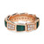 An image of a Bvlgari Serpenti Viper women's ring with diamonds and malachite. The ring is crafted in rose gold and showcases a series of rectangular faceted green malachite, alternated with clusters of sparkling diamonds. The Bvlgari logo is engraved on the top side of the ring. The ring is presented in a close-up view with a slight angle, focused on the upper portion to highlight the gemstones and diamond settings. The background is a neutral white, providing a clear contrast to the warm tones of the rose gold and the rich green of the gemstones.