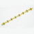 An image of a Catherine Mullen women's bracelet with diamonds and gemstones. The bracelet is displayed diagonally across the frame from the bottom left corner to the upper right corner, with a close-up view that allows for clear visibility of the details. The bracelet features a series of yellow gold links, each adorned with a central emerald, ruby and sapphire gemstones and surrounded by small round cut diamonds. The background is a plain, untextured white surface that contrasts with the bracelet's vibrant colors and shiny gold finish.