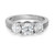 An image of an engagement three stone ring with lab grown diamonds, positioned at a slight angle from the front. The ring features a trio of round diamonds set in a row on a sleek 14k white gold band. The photograph captures the ring from a close distance, highlighting the brilliance and clarity of the diamonds.