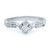 An image of a women's white gold engagement ring by Rachel Koen, featuring a central diamond set in a geometric design. The ring is positioned upright and viewed from the front at a close distance, showcasing additional smaller diamonds embedded along the band. The polished white gold metal enhances the sparkle of the diamonds, highlighting the intricate craftsmanship.
