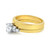 An image of a women's engagement ring with diamonds by Rachel Koen. The ring features a central round diamond set in a white gold prong setting, flanked by smaller square diamonds. The band is made of yellow gold. The ring is positioned horizontally, viewed from a side angle, and photographed at a close distance to highlight the details of the diamonds and metalwork.Excellent pre-owned condition. 