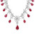 An image of a Rachel Koen women's necklace featuring diamonds and rubies. The necklace is displayed from a front angle at a close distance, highlighting its intricate design in white gold. It showcases a series of diamond clusters, resembling floral patterns, interspersed with large, teardrop-shaped red ruby gemstones. The arrangement creates a symmetrical and elegant appearance. Excellent preowned condition.
