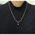 An image of a "Necklace with Amethyst" designed for women by Rachel Koen. The necklace is positioned around the neck of a person wearing a black ribbed top. It features a gold color stainless steel chain with purple amethyst gemstones arranged in a "Y" shape, with a teardrop gemstone at the center. The photograph is taken from a front-facing angle at a close distance, capturing the details of the necklace against the dark fabric. Great preowned condition.