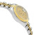 An image of a pre-owned wristwatch captured from a side profile view, opposite the crown. The watch is angled slightly upward, showcasing its two-tone metal band and gold-colored face. The fluted bezel adds a touch of elegance, and the watch is positioned at a medium distance, highlighting its design details.