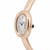 An image of a pre-owned Cartier women's wristwatch. The watch is positioned at a slight angle, showcasing its elegant oval face and rose gold band. Roman numerals are displayed on the dial, and a blue gemstone adorns the crown. The watch is photographed from a close distance, highlighting its refined details and smooth finish.