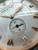 An image of a pre-owned men's Audemars Piguet wristwatch, showcasing a close-up view of the dial from a slight angle. The focus is on the intricate details of the small seconds subdial and the elegant design of the hour markers and hands. The watch face features Roman numerals and diamond accents, with the brand name clearly visible. The texture and craftsmanship of the watch are highlighted in this detailed shot.