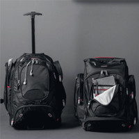 A black wheeled backpack with a retractable handle, featuring multiple compartments and zippers.