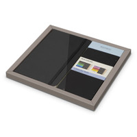 A Moleskine bundle featuring a black sketchbook, colourful art tools, and a logo on the packaging.