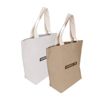 A large washable kraft paper bag in brown and white with cotton handles and a logo on the front.