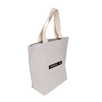 A large grey washable kraft paper bag with cotton handles and a logo.