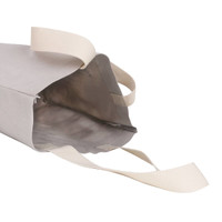 A large, grey washable kraft paper bag with a beige cotton handle and an open top.
