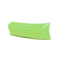 An inflatable lazy bed in bright green, featuring a streamlined design with a smooth surface.
