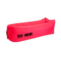 A bright pink inflatable lazy bed with a logo on the side. It features a simple, elongated design.