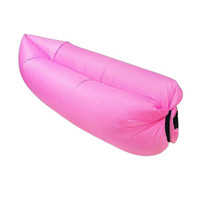 A pink inflatable lazy bed with a sleek design, featuring a black closure mechanism.
