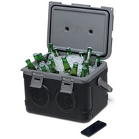 A sound box cooler in black containing bottles and ice, featuring speakers and a handle on the side.