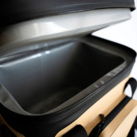 Open insulated cooler bag with zippered lid for outdoor use.