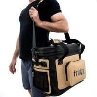 Man carrying a Fridgy insulated cooler bag with shoulder strap, ideal for outdoor adventures.
