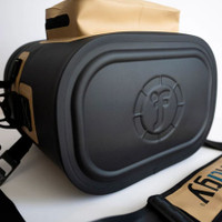 Stylish black and tan camera bag with embossed logo, versatile photography gear storage.