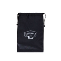 A black drawstring bag containing a Backyard Cornhole Set, featuring a logo on the front.