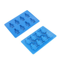 A blue custom shaped moulded ice cube tray featuring playful ice cube designs. It includes two trays with various shapes.