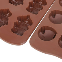 Custom shaped moulded ice cube tray featuring brown silicone, with various animal and object designs.