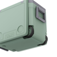 A green cooler box with wheels and a folding table, featuring a grey handle. Includes branding on the side.