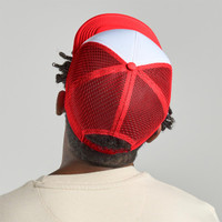 A red and white trucker cap featuring a mesh back and a logo at the rear.
