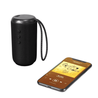 A black cylindrical Bluetooth speaker with control buttons and a phone displaying music playback beside it.
