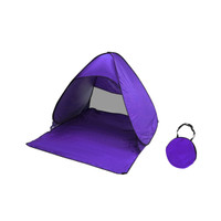 A purple pop-up beach tent with an attached carrying case, designed for leisure and outdoor sunshade use.