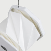 A white, foldable lantern with a geometric design, featuring a hanging string and a logo on the base.