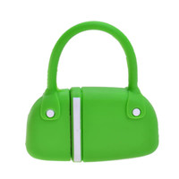 A green handbag-shaped flash drive with a handle, featuring a logo on its surface.
