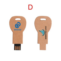 An eco-friendly flash drive shaped like a key, featuring a natural finish with branding on both sides.