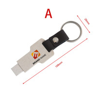 An eco-friendly mini flash drive keychain in a cream colour with a black keyring. It features a logo.