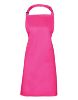A bright pink Colours Bib Apron with a neck strap, designed for chefwear. It features a branding logo.