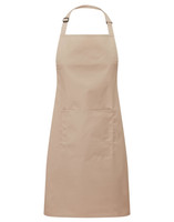 A beige bib apron with a front pocket and an adjustable neck strap. It features a logo on the front.