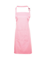 A pink bib apron with a pocket, featuring adjustable straps and a simple design. It includes a logo.