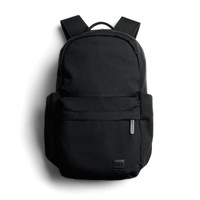 A black daypack with adjustable straps and a front pocket, featuring a branding logo.