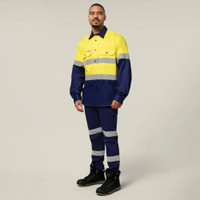 Man wearing an yellow and navy taped high-visibility work shirt.