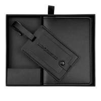 A black travel gift set featuring a luggage tag and a matching holder, neatly presented in a box.