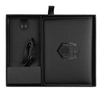 A black leather travel gift set featuring a luggage tag and matching notebook, presented in a sleek box.