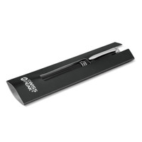 A black metal ballpoint pen with a silver clip, presented in a sleek black packaging featuring a logo.